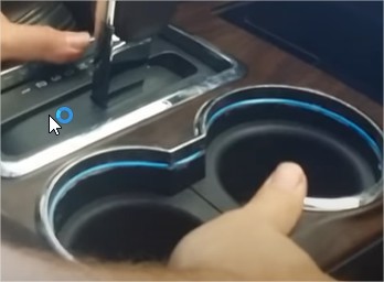 Attach the cup holder to the car. Â